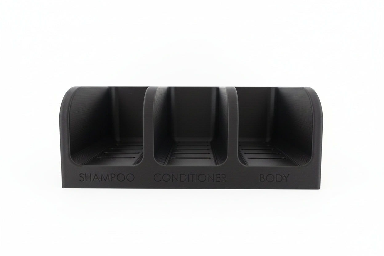 Black three-compartment container labeled 'Shampoo', 'Conditioner', and 'Body' on a white background.