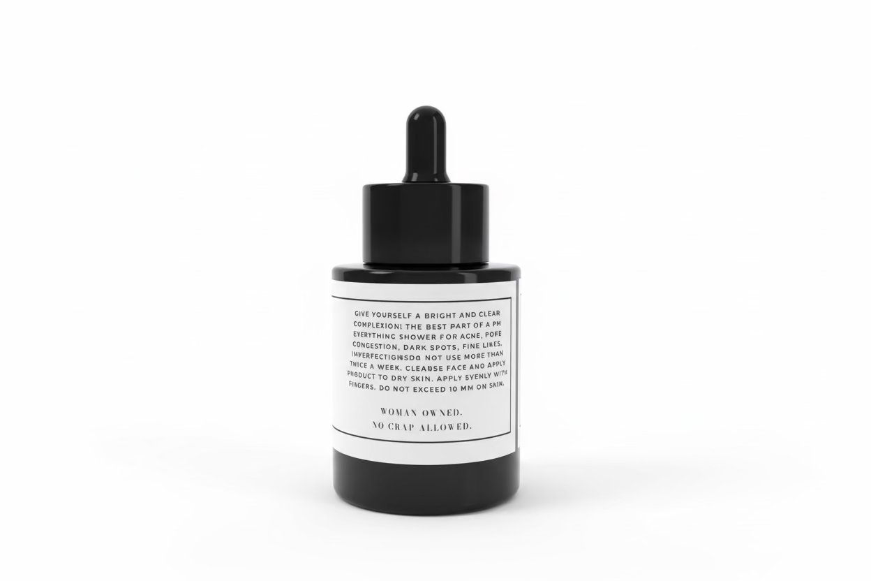 Black dropper bottle with a white label on a white background