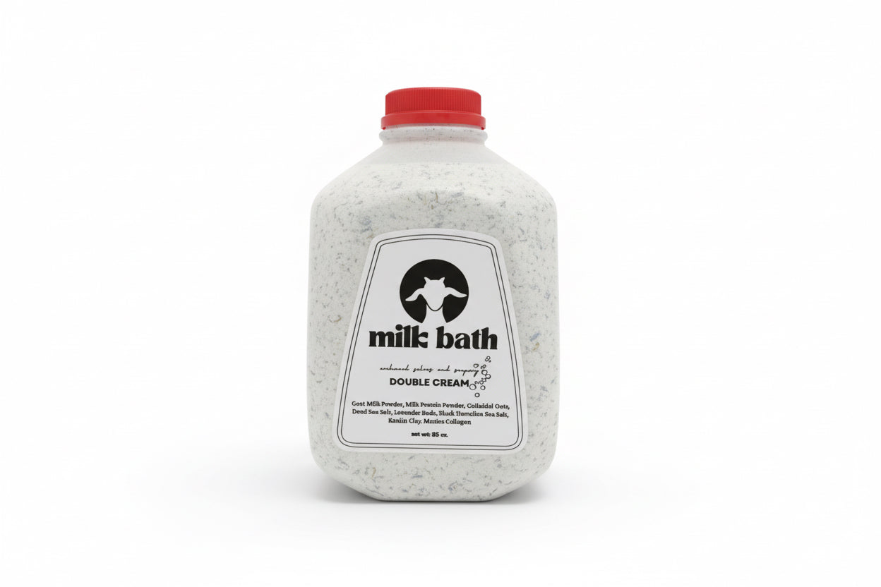 Bottle of milk bath with a label on a wooden surface