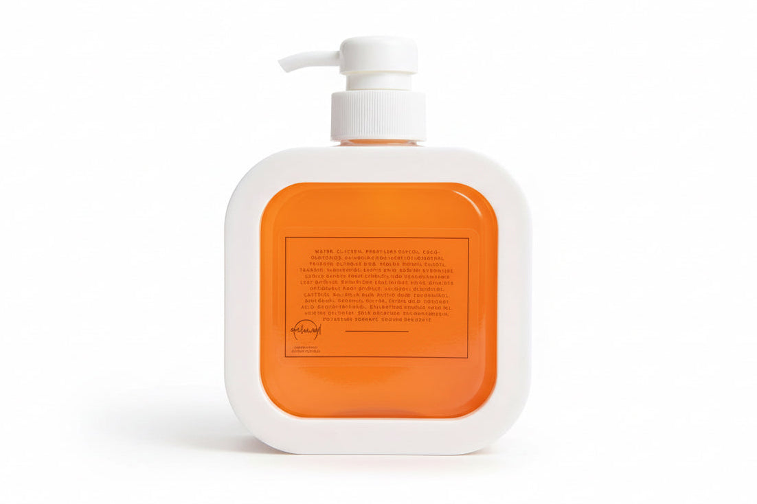 White bottle with an orange label on a white background