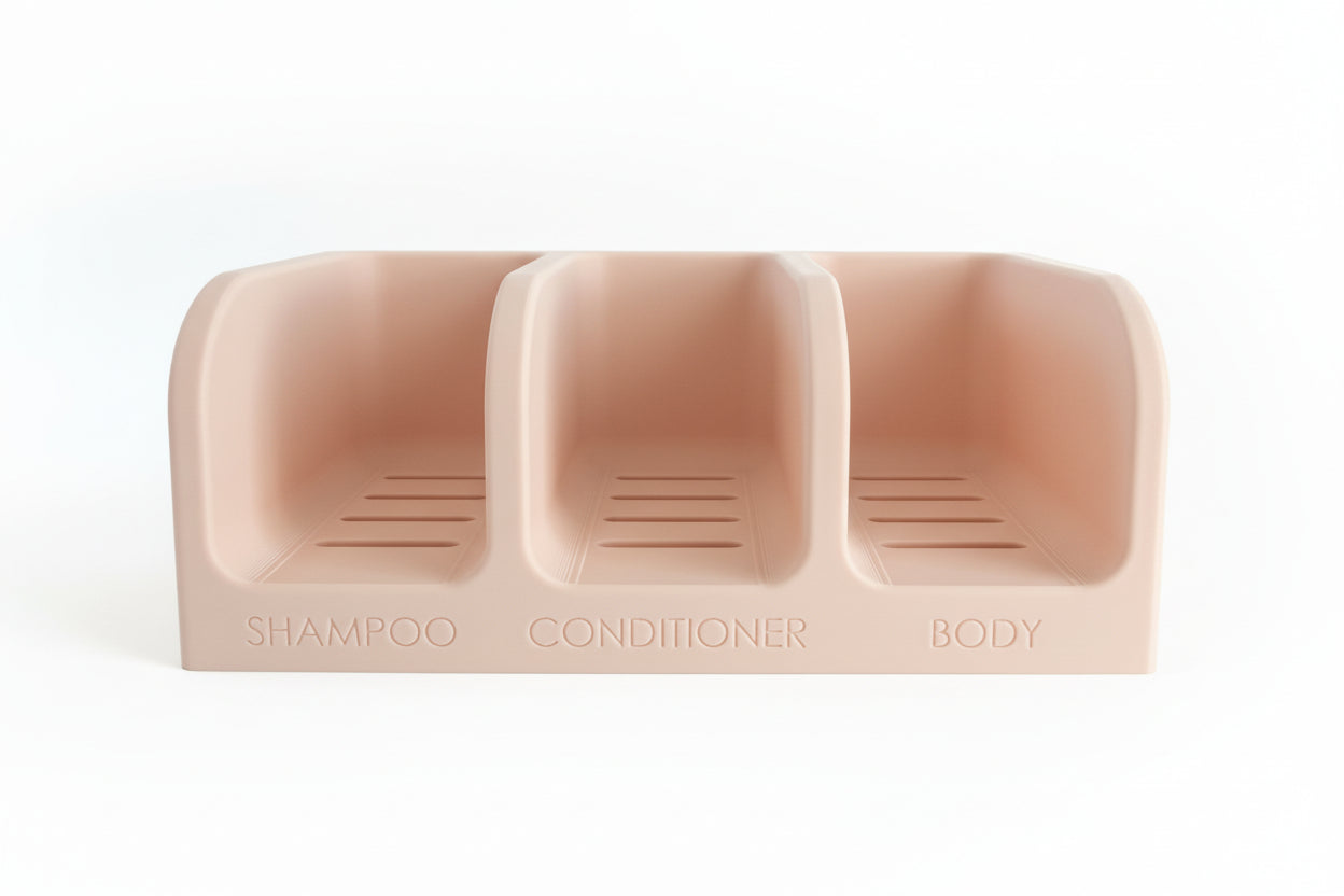 Beige three-compartment container labeled 'Shampoo', 'Conditioner', and 'Body' on a kitchen counter.