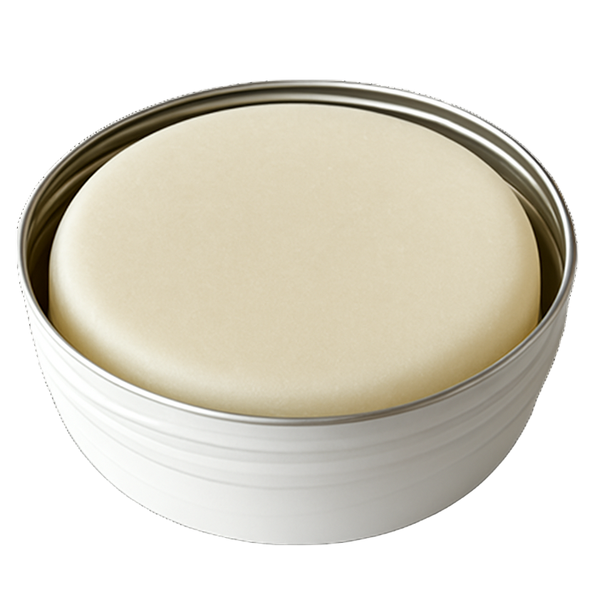 Bar of soap in a metal dish on a white background